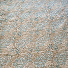 Block-print quilted king bedspread with pillowcases in blue and pink, from Inside Living Singapore Front view.