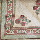 Block-print quilted king bedspread with pillowcases in blue and pink, from Inside Living Singapore Side view.