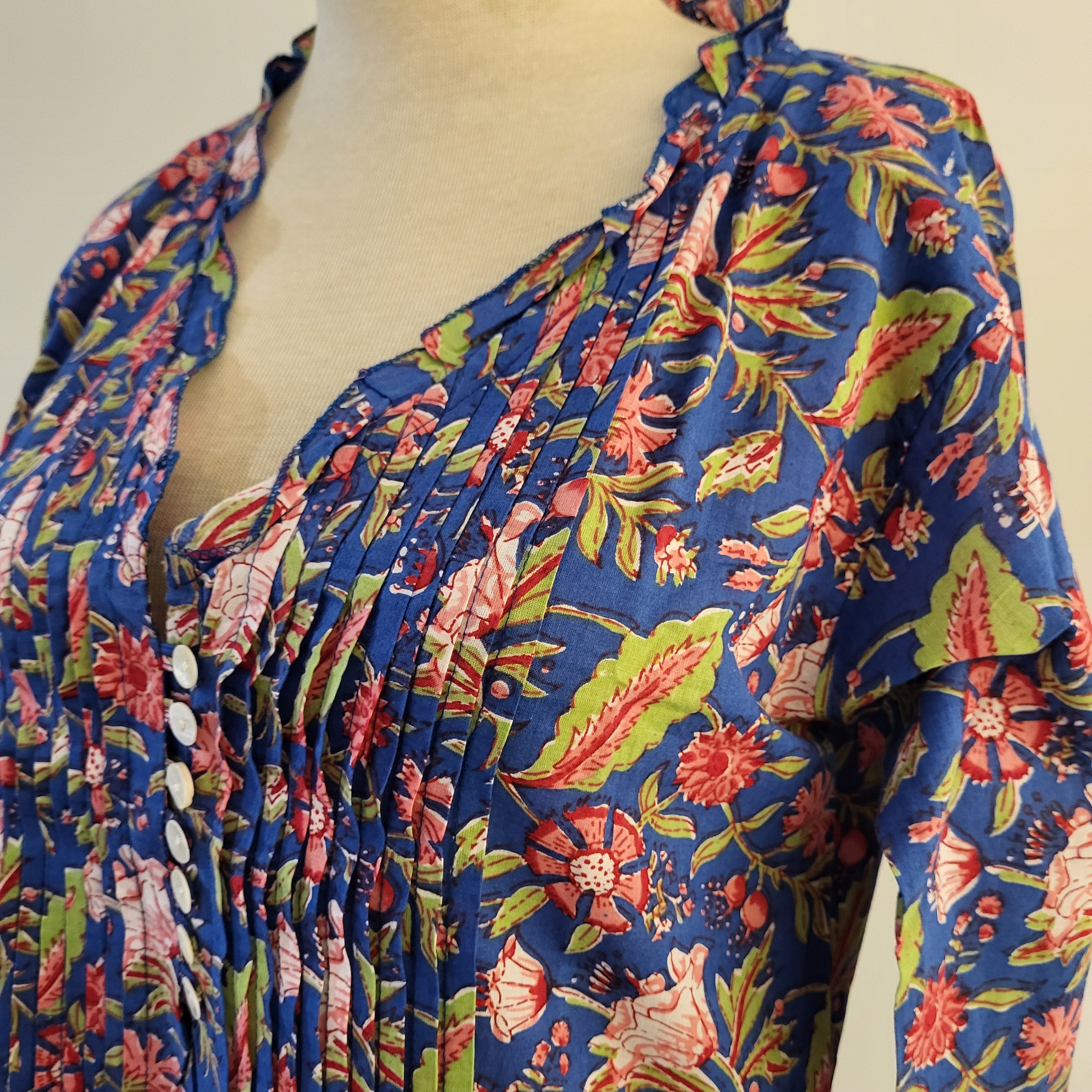 Pleated block print cotton dress with V-neck and mother of pearl buttons, assorted colours