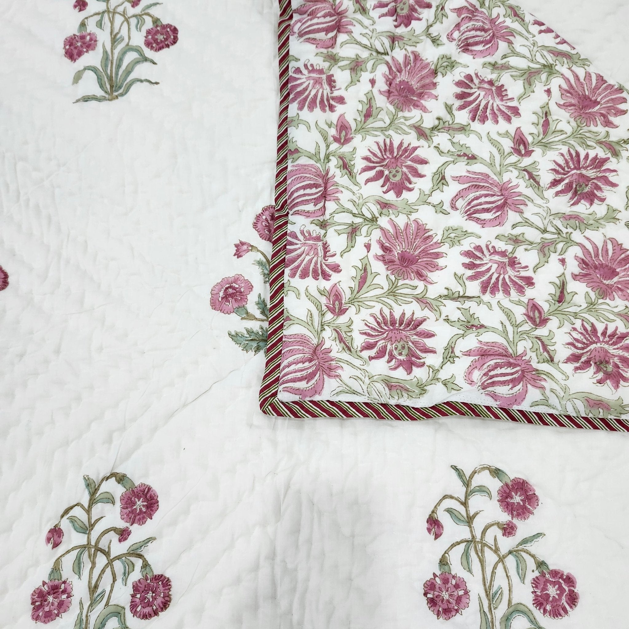 Reverse side of the block print quilt showing the alternative floral pattern, single bed size.