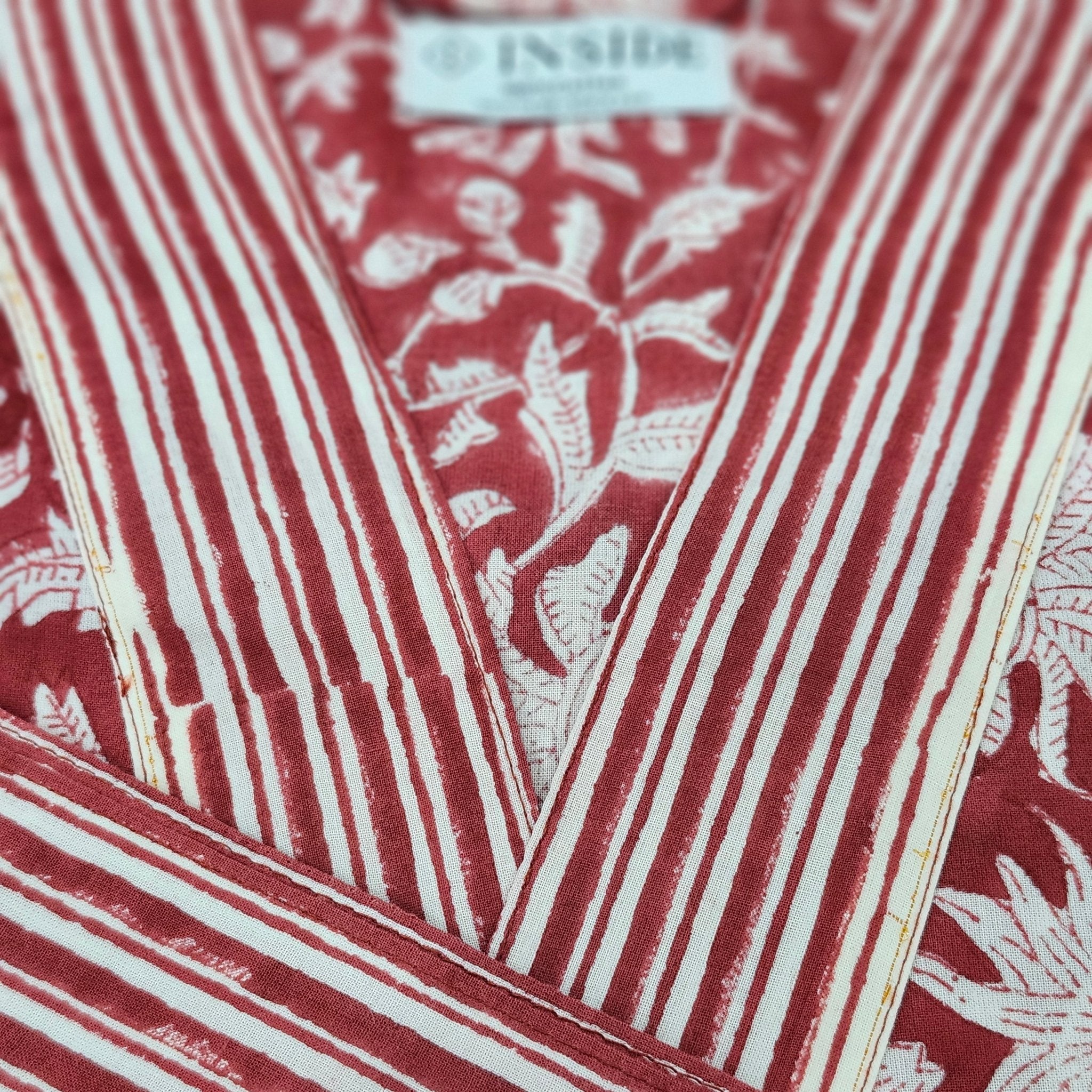 Cotton block print robe in festive red, handmade lightweight dressing gown with hand-printed pattern, close-up view