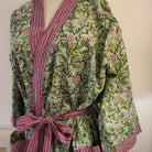 Block-printed cotton robe in a floral pattern on sage with contrast red trim, one size, machine wash
