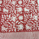Block print cotton tablecloth in festive red, handmade hand-printed cloth for the dining table, detail view