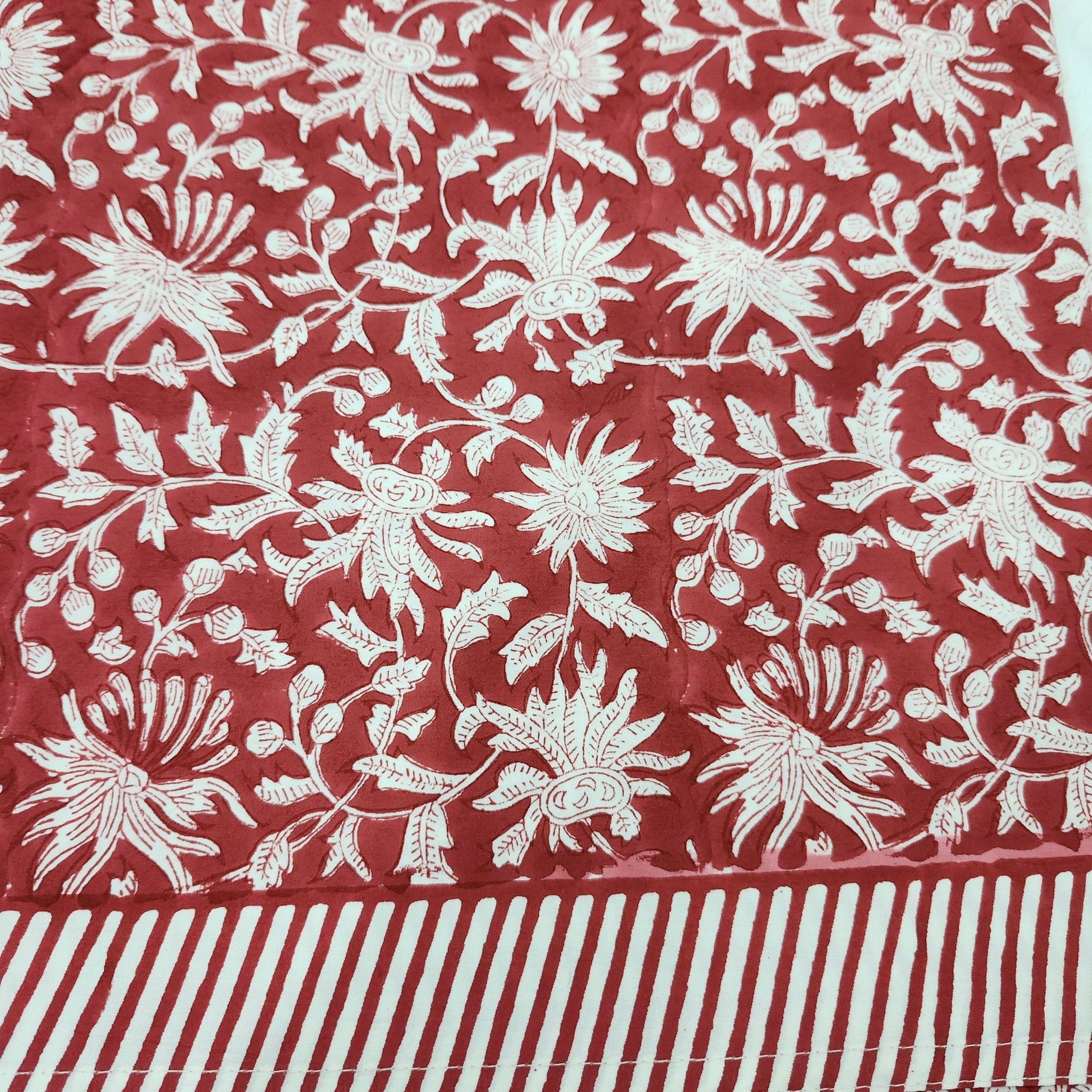 Block print cotton tablecloth in festive red, handmade hand-printed cloth for the dining table, detail view