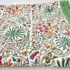 Rainforest design block print cotton tablecloth in multicolour on olive, 225 x 150 cm