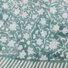 Block print cotton tablecloth in floral green, handmade hand-printed cloth for the dining table, detail view