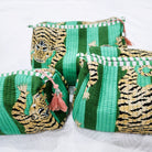 Block-print wash bag in emerald with a tiger and stripe design, lined with four pockets and a zip, in three sizes