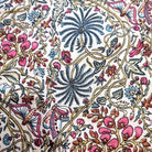 Cotton block-printed table runner in the rainforest pattern with palms, butterflies and flowers, white