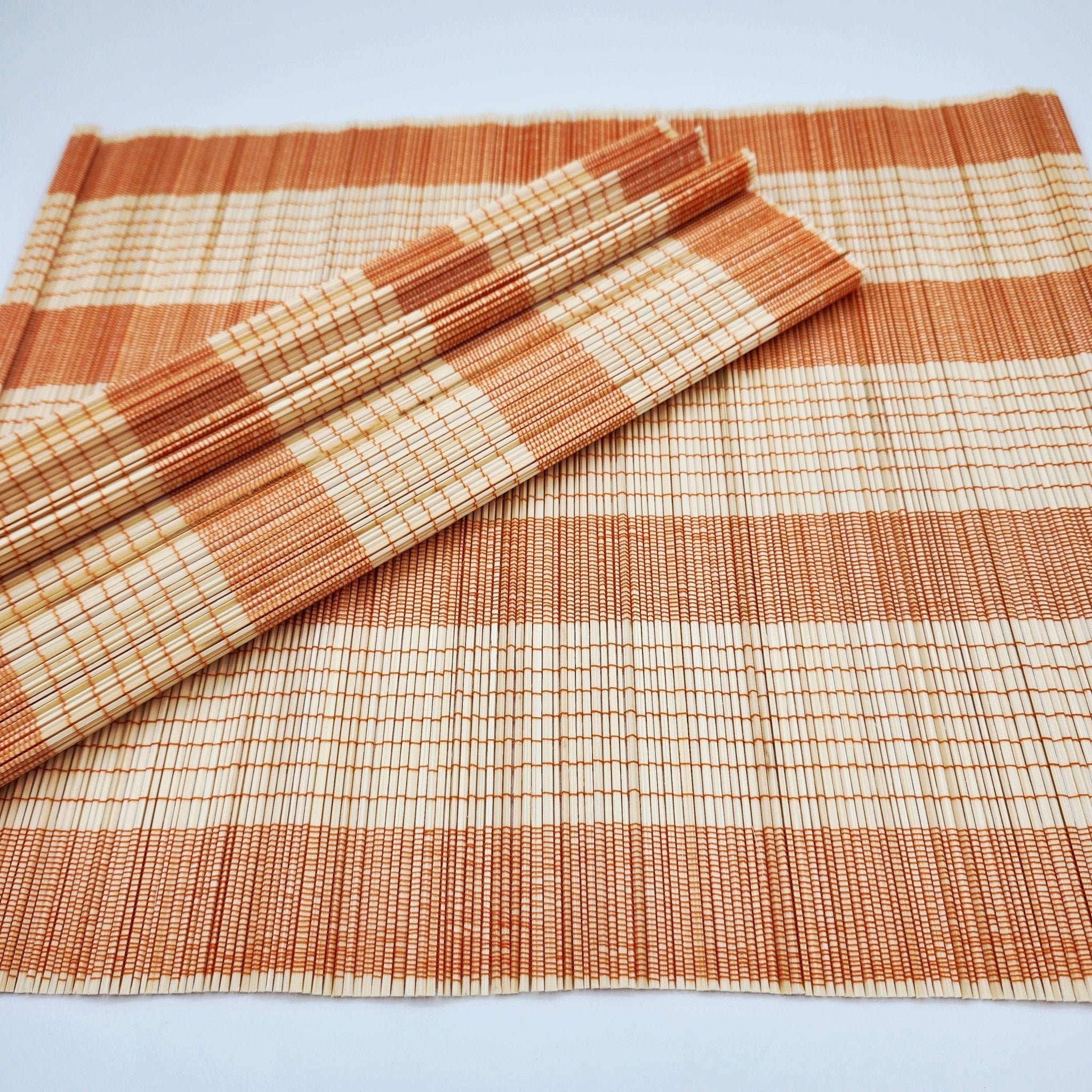 Bamboo Placemat Orange from Inside Living Singapore, detail view.