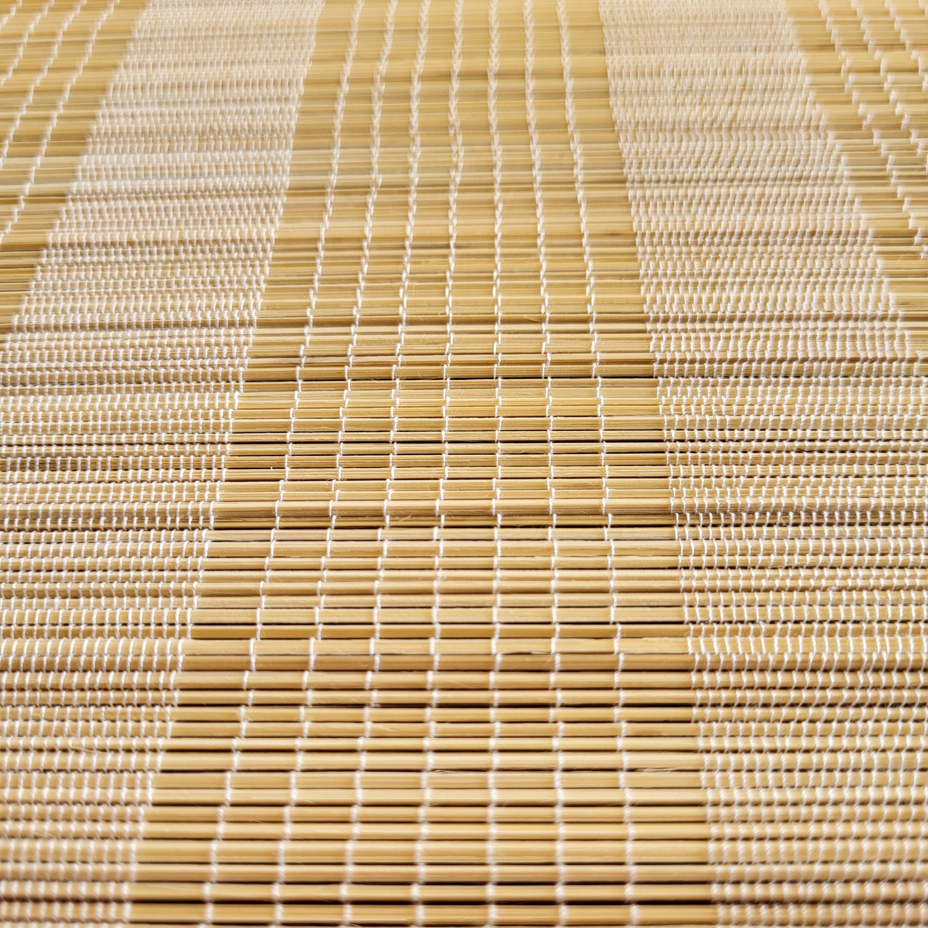 Natural bamboo placemat from Inside Living, woven table mat for everyday and special dining settings, side view
