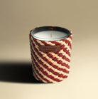 Rose oudh scented soy candle in a handwoven raffia and leather jar, 7 cm diameter, 10 cm high, 40 hour burn