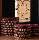 Amber scented soy candle with a handwoven raphia exterior, two sizes, up to 80 hours burn time