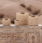 Scented soy candle with a hand-woven raffia exterior and warm oriental fragrance, 9 cm tall, 40-hour burn