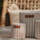 Cumin-scented candle in a hand-painted white and terracotta striped ceramic jar, 9 cm high, 40 hour burn