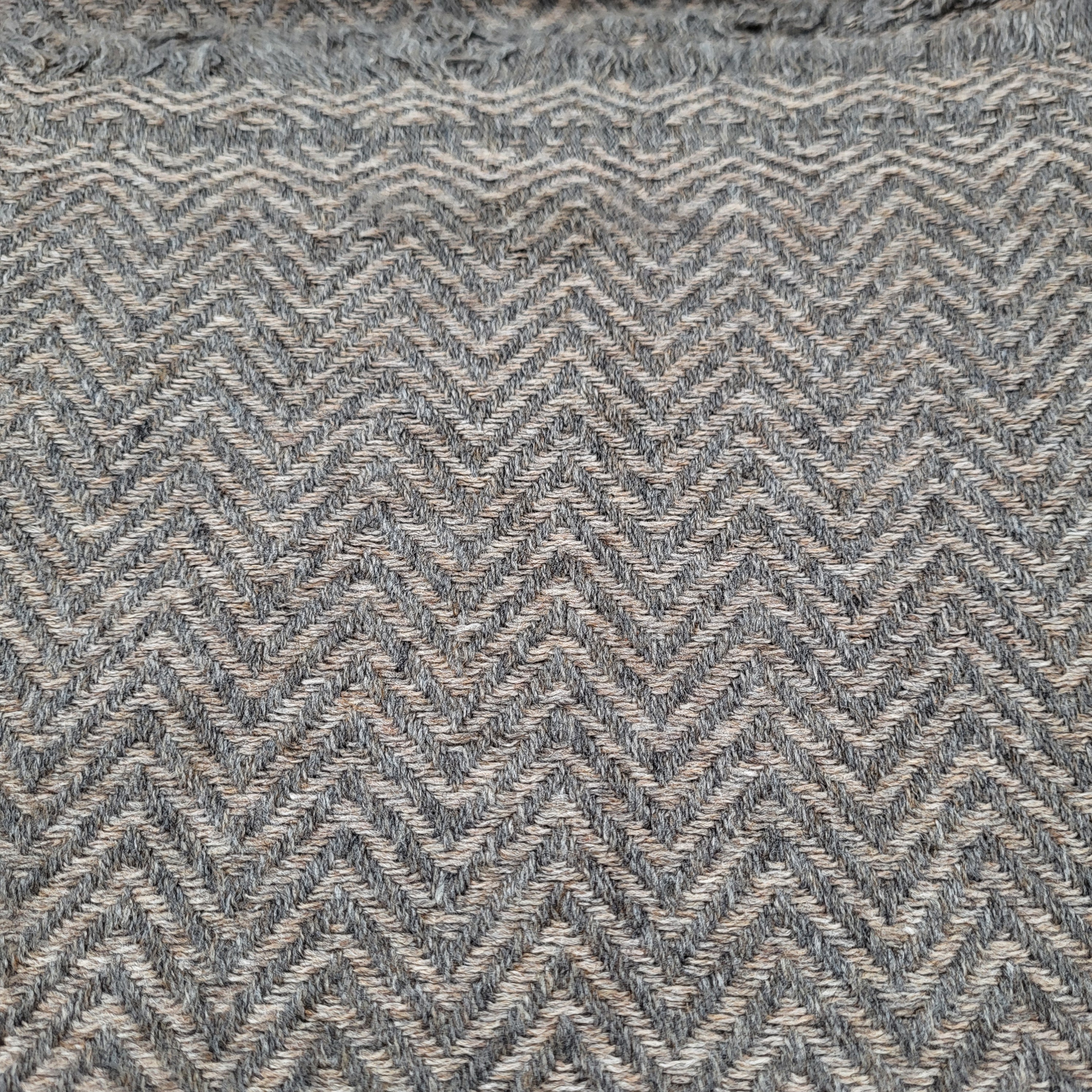 Cashmere Shawl Herringbone: soft woven wrap to wear or layer, from Inside Living Singapore. Lifestyle styling shot.