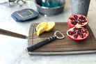 Bottle opener in stainless steel with a charcoal faux shagreen handle, comfortable to hold and easy to use