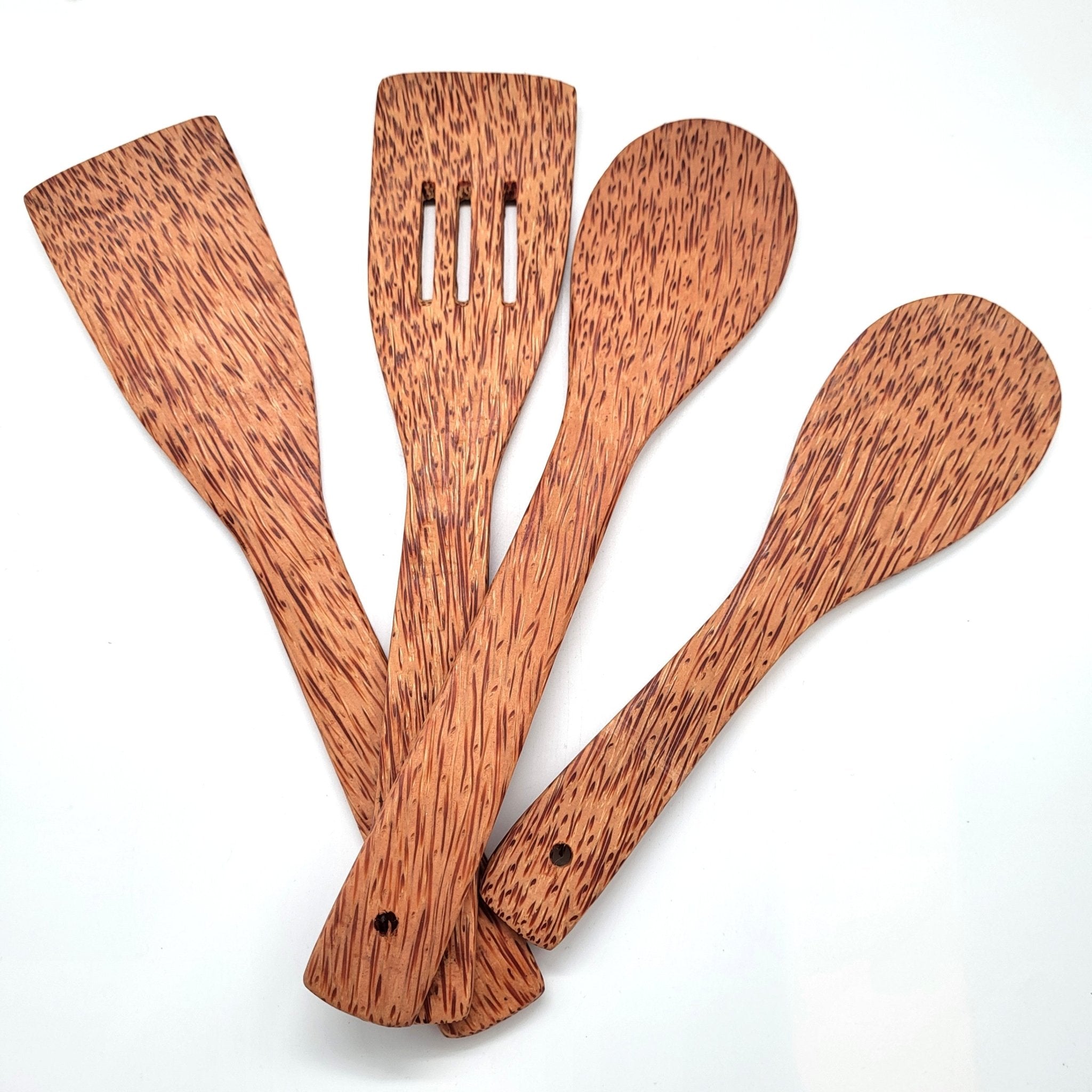 Set of four kitchen cooking and serving spoons made from natural coconut wood, light and hard-wearing