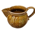 Ceramic Creamer styled in a room setting, plates at Inside Living Singapore.