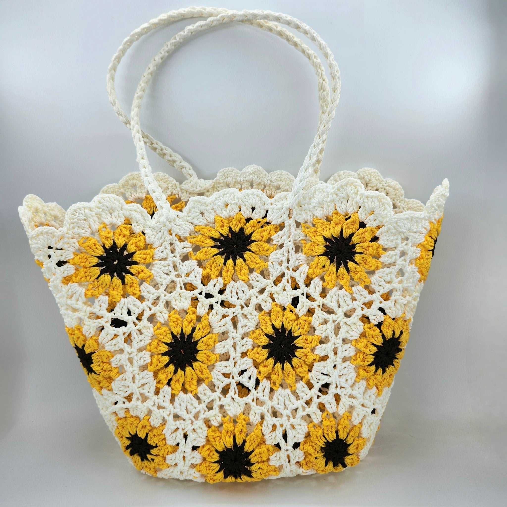 Handmade crochet beach bag in a sunflower design, one of three colours in the range, made in Vietnam