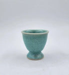 Ceramic egg cup, hand-finished tableware for serving boiled eggs at breakfast, side view