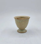 Ceramic egg cup, hand-finished tableware for serving boiled eggs at breakfast, close-up view