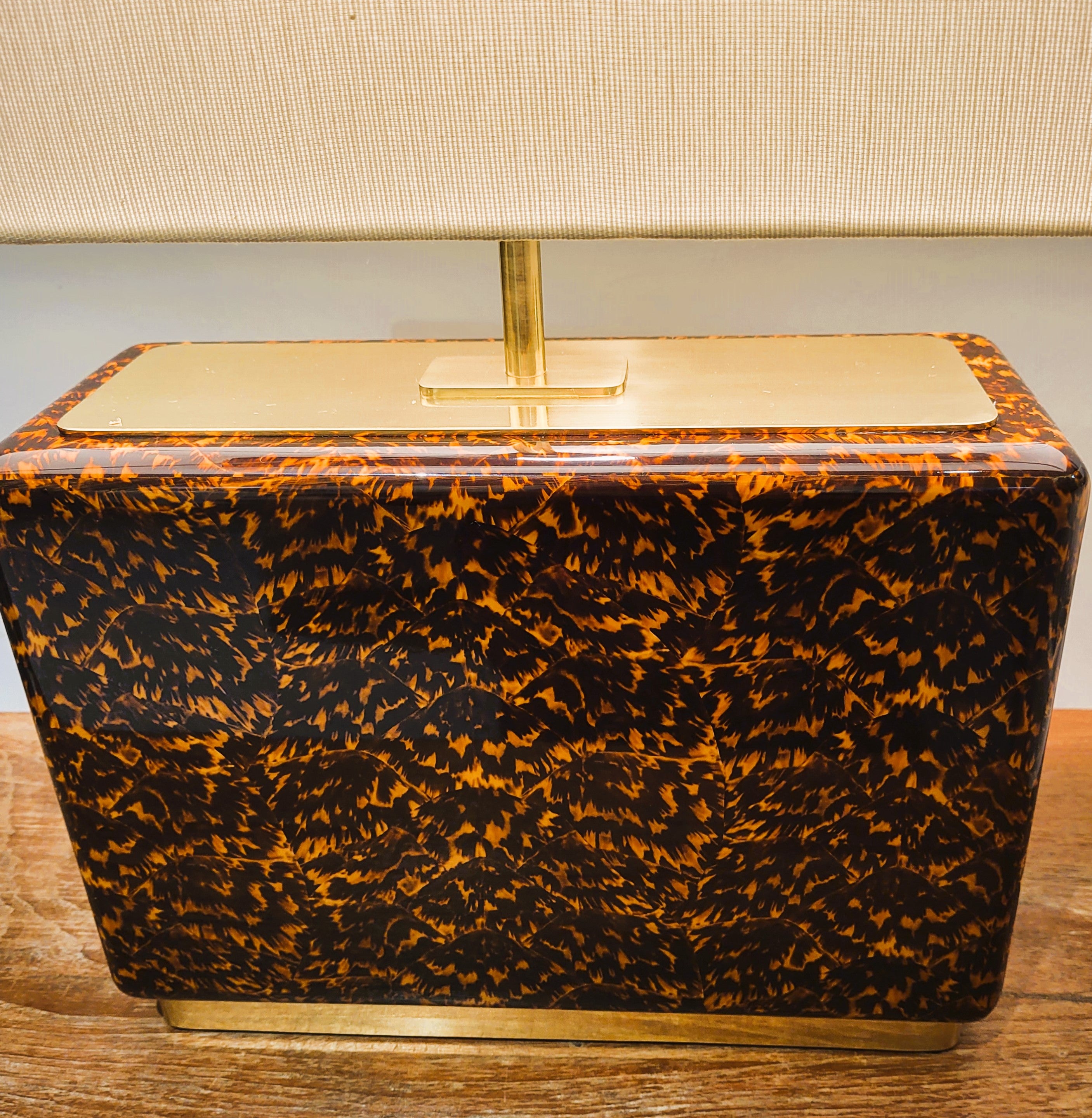 Faux tortoiseshell and brass table lamp with a cream silk shade, available in two sizes