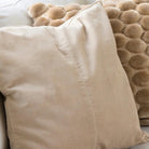Velvet Base New Beige Cushion from Inside Living Singapore, cushions. Shown styled in a home setting.