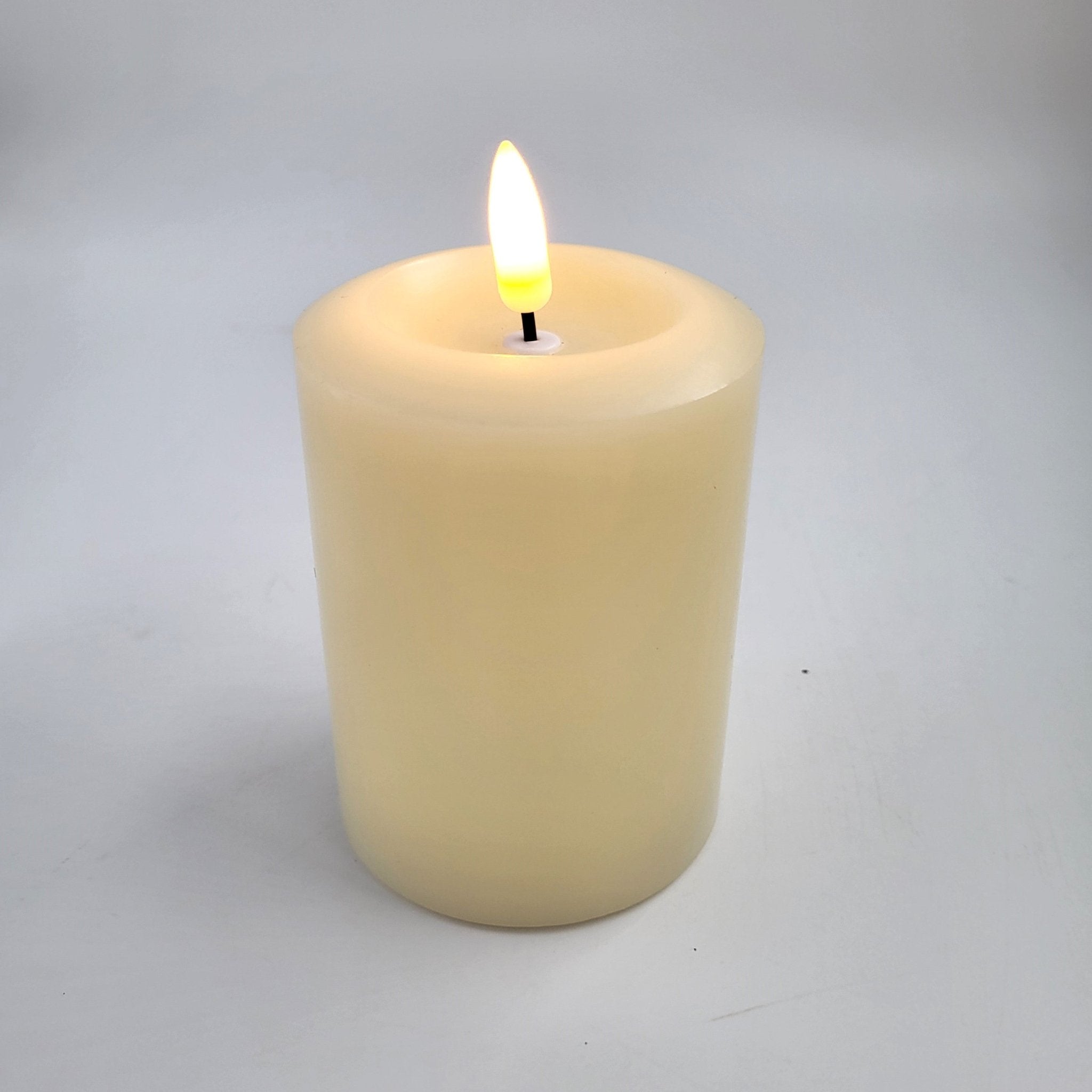 Ivory flameless LED pillar candle from Inside Living, realistic flickering battery candle for safe ambient lighting