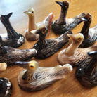 Horn chopstick stand in a duck shape, handcrafted natural rest in tones from dark brown to almost white