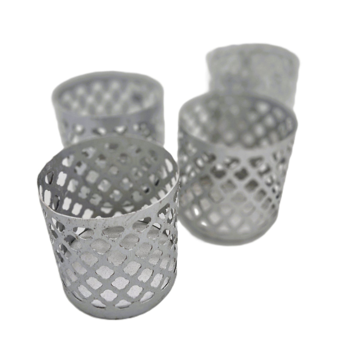 Silver iron tea light holder with a pierced fret-work design, 9 cm high, also made in a gold painted finish