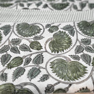 Block-print cotton tablecloth in the Lotus design, white on burgundy with striped edge, machine washable