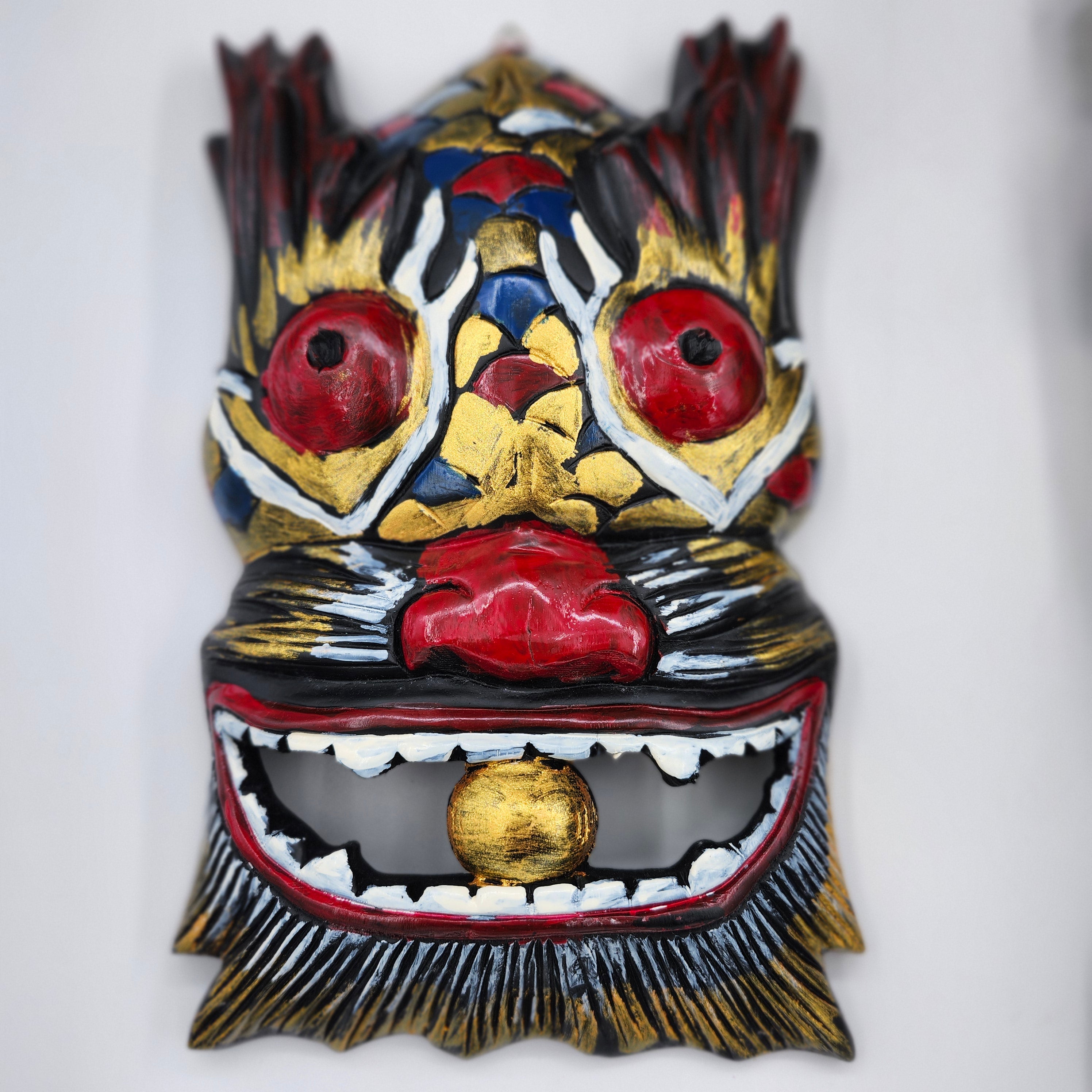 Handmade carved and painted wooden Simba wall mask with a rustic finish, about 25 cm tall
