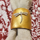 Set of six napkin rings handcrafted from horn with a gold lacquer finish, ideal for festive dining