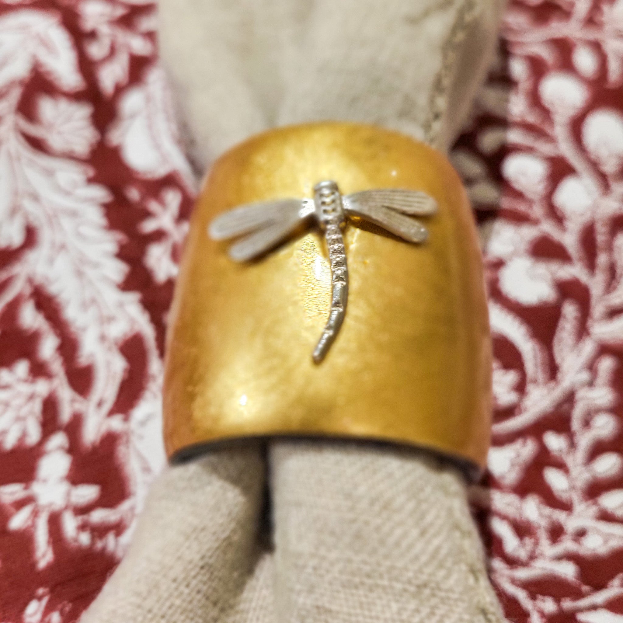 Set of six napkin rings handcrafted from horn with a gold lacquer finish, ideal for festive dining