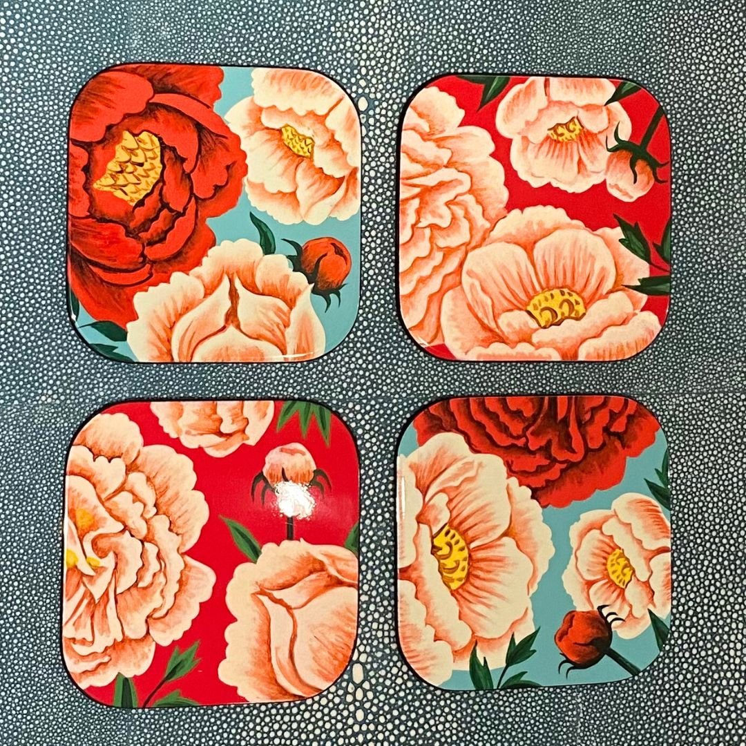 Set of four handmade lacquer coasters with colourful peony designs and a glossy lacquered finish