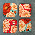 Set of four handmade lacquer coasters with colourful peony designs and a glossy lacquered finish