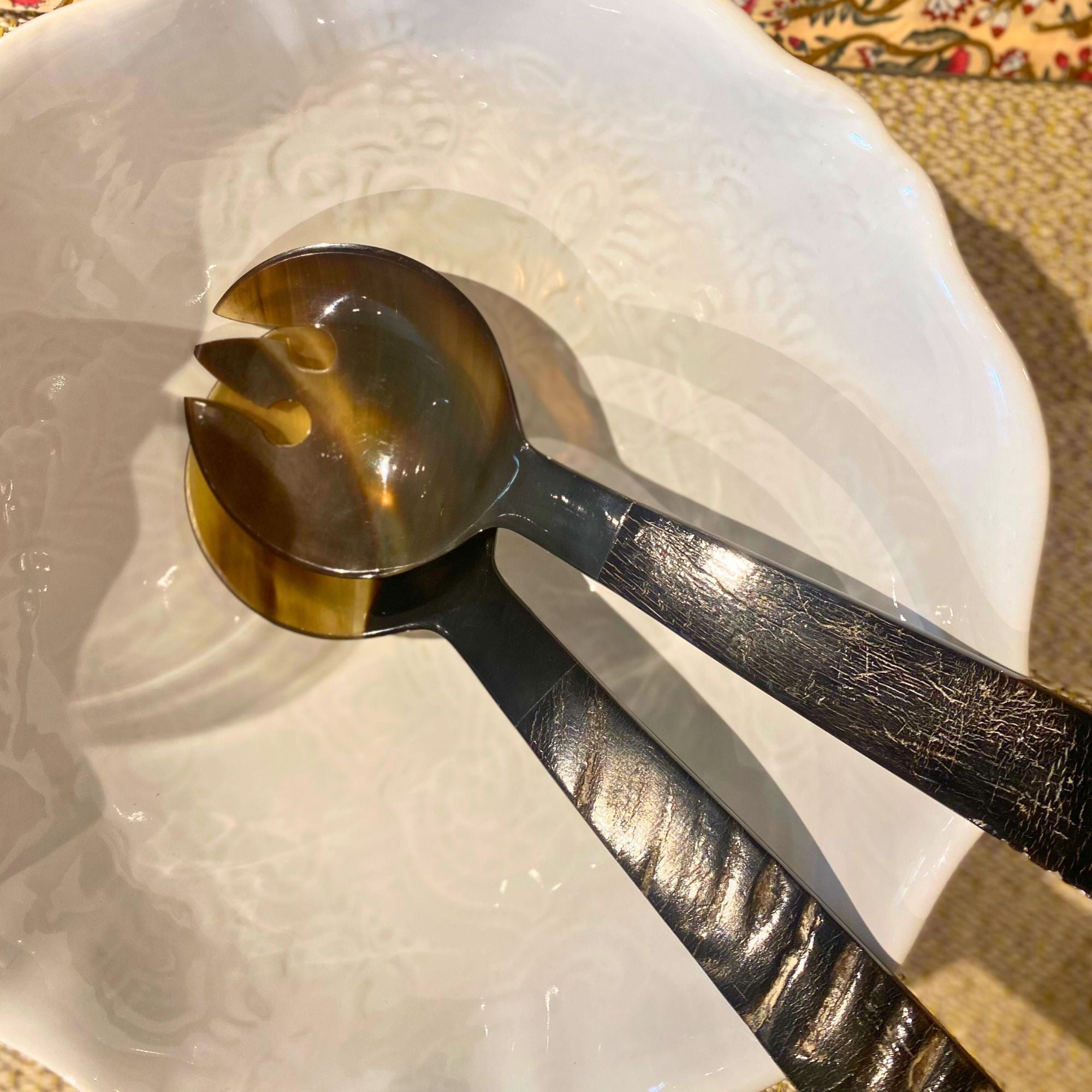 Horn salad server set in black with wood-effect carved handles, a handcrafted natural serving pair