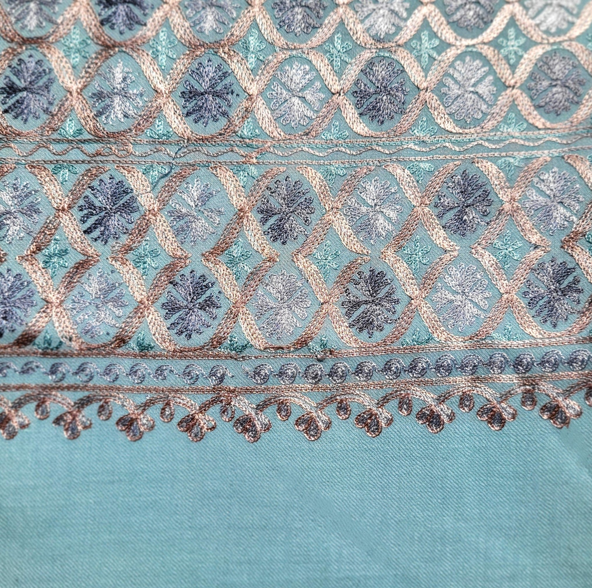 Embroidered Pashmina Small Circle from Inside Living Singapore. Shown styled in a home setting.