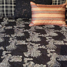 Cotton voile quilt block-printed with silver birds of paradise on black, hand-quilted, in queen and king sizes