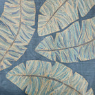 Aqua silk cushion cover with banana leaves block-printed and embroidered in blue, teal and grey, 45 x 45cm
