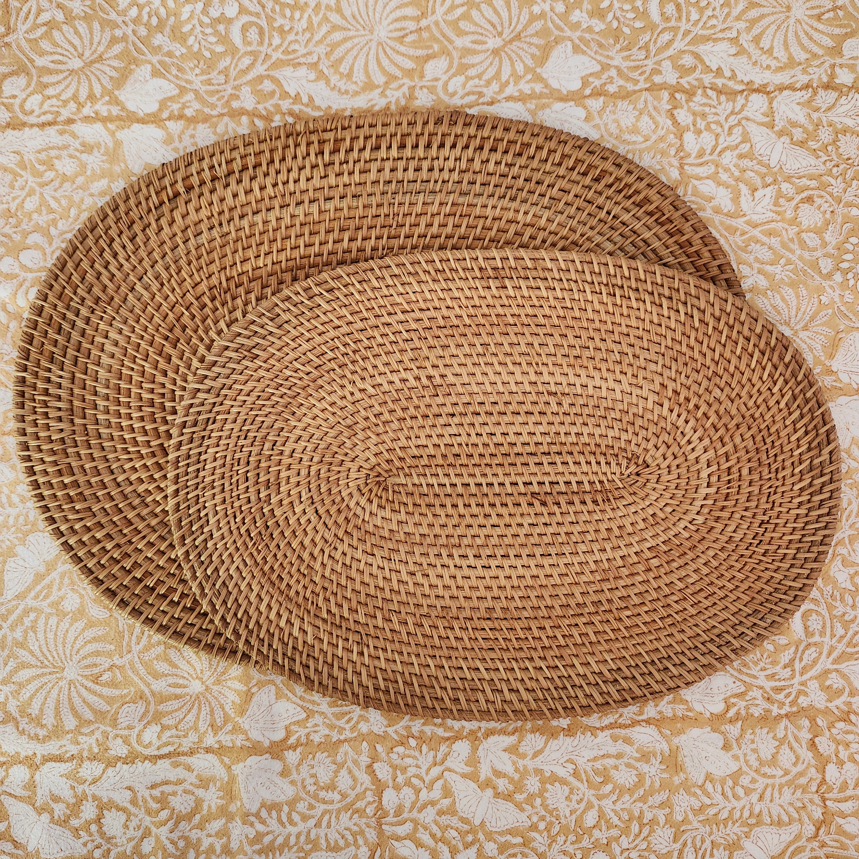 Oval handwoven natural rattan placemat, lightweight table mat for everyday and special dining.