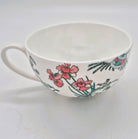 Singapore Toile cup and saucer from Inside Living, fine ceramic set with heritage East-meets-West toile pattern, side view