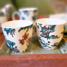Singapore Toile tea set from Inside Living, fine ceramic teapot and cups with heritage toile pattern, angled view