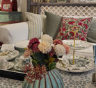 Suzani Linen Cushion Bright Flower, detail view, from the Inside Living Singapore homeware collection.