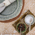 Round Rattan Placemat, styled in a room setting, from the Inside Living Singapore homeware collection.