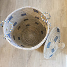 Blue seagrass laundry basket with lid from Inside Living, woven natural-fibre storage hamper for the home, close-up detail