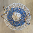 Blue seagrass laundry basket with lid from Inside Living, woven natural-fibre storage hamper for the home, angled view