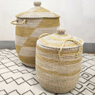 Handwoven seagrass laundry basket with white detailing, handles and a lid, in small, medium or large