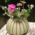 Sthal Salon round vase in avocado, ribbed high-fired terracotta, 16 cm diameter and 11 cm high, styled in a room setting