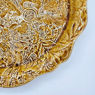 Round ceramic pizza plate in pineapple design, hand-finished tableware for serving pizza and sharing dishes, detail view